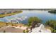 Beautiful aerial view of the community with a lake and luxurious amenities at 3848 Corsican Pl, Lake Alfred, FL 33850