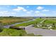 Scenic aerial view showcasing waterway, walking trails, common areas, and other community amenities at 3848 Corsican Pl, Lake Alfred, FL 33850