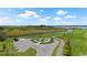 Overhead view of community area with walking trails, seating, and lush landscaping at 3848 Corsican Pl, Lake Alfred, FL 33850