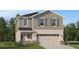 Two story home featuring a two car garage, neutral stucco, gray wood and stone exterior accents and manicured lawn at 3848 Corsican Pl, Lake Alfred, FL 33850