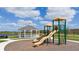Community playground with slides, tic-tac-toe, gazebo, and lake views for the Gathering to enjoy at 3848 Corsican Pl, Lake Alfred, FL 33850