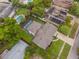 A birdseye view of a home featuring a pool in a landscaped yard at 3902 Brandeis Ave, Orlando, FL 32839