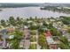 Scenic aerial view of a waterfront community, showcasing residences and lush greenery at 3902 Brandeis Ave, Orlando, FL 32839