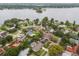 Aerial view of a lakeside neighborhood with mature trees, and waterfront properties at 3902 Brandeis Ave, Orlando, FL 32839