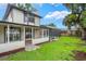 Inviting backyard with a screened-in patio and pool at 3902 Brandeis Ave, Orlando, FL 32839
