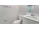 Cozy bathroom featuring a toilet, small vanity with quartz countertop, and modern fixtures and towel racks at 3902 Brandeis Ave, Orlando, FL 32839