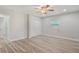 Bedroom featuring wood-style flooring, a double closet, and natural light at 3902 Brandeis Ave, Orlando, FL 32839