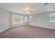 Spacious bedroom featuring a bay window, neutral carpet, and ample natural light at 3902 Brandeis Ave, Orlando, FL 32839