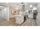 Modern kitchen features stainless appliances, white cabinets and quartz countertops at 3902 Brandeis Ave, Orlando, FL 32839