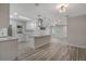 Bright open kitchen features an island with cooktop and stainless steel appliances at 3902 Brandeis Ave, Orlando, FL 32839