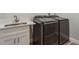Convenient laundry area featuring a sink with white cabinet, a quartz counter, and dark colored washer and dryer at 3902 Brandeis Ave, Orlando, FL 32839