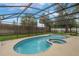 Inviting screened-in pool and spa area, ideal for entertaining at 3902 Brandeis Ave, Orlando, FL 32839