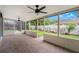 Screened porch with brick floors and ceiling fans overlooking fenced yard at 3902 Brandeis Ave, Orlando, FL 32839