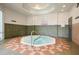 Indoor hot tub featuring an octagon shape and tile flooring at 3938 Calabria Ave, Davenport, FL 33897