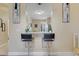 Kitchen pass-through bar with granite countertop and bar stool seating at 3938 Calabria Ave, Davenport, FL 33897