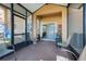 Enclosed patio with seating providing an outdoor living space at 3938 Calabria Ave, Davenport, FL 33897