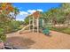 Community playground with slide and tic-tac-toe game at 3938 Calabria Ave, Davenport, FL 33897
