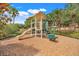 Community playground with slide and tic-tac-toe game at 3938 Calabria Ave, Davenport, FL 33897