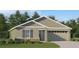 Charming single-story home with a two-car garage, manicured lawn, and craftsman-style details at 3946 Bigarade Ln, Lake Alfred, FL 33850