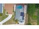 Bird's eye view highlighting the home's layout with a screened-in pool and well-maintained backyard at 404 Obo Dr, Davenport, FL 33896