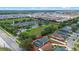 Aerial view showcases the property with its screened-in pool within a suburban neighborhood at 404 Obo Dr, Davenport, FL 33896