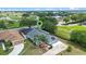 Aerial view of a residential home with a sparkling pool and large yard in a quiet suburban neighborhood at 404 Obo Dr, Davenport, FL 33896