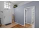 Inviting foyer with neutral walls, tile floors, and transom window providing lots of natural light at 404 Obo Dr, Davenport, FL 33896