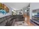Open concept living room with hardwood floors and view to eat-in kitchen at 404 Obo Dr, Davenport, FL 33896