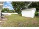 Expansive backyard with a detached garage and patio perfect for summer barbecues and relaxation at 4111 Dublin St, Orlando, FL 32812