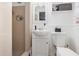 Bathroom featuring a tiled standing shower, vanity with sink, medicine cabinet, and white toilet at 4111 Dublin St, Orlando, FL 32812