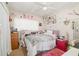 Charming bedroom with pink accents, a bed with star patterned comforter, and a ceiling fan at 4111 Dublin St, Orlando, FL 32812