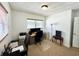A bright home office offers a comfortable work environment with natural light and neutral decor at 4111 Dublin St, Orlando, FL 32812
