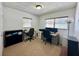 A well-lit home office features dual workstations with neutral walls and carpeted floors at 4111 Dublin St, Orlando, FL 32812