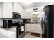 Modern kitchen with stainless steel appliances, granite countertops, and ample cabinet space at 4111 Dublin St, Orlando, FL 32812