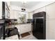Modern kitchen with stainless steel appliances, granite countertops, and ample cabinet space at 4111 Dublin St, Orlando, FL 32812