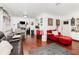 Open-concept living room featuring wood floors, comfortable seating, and dining area at 4111 Dublin St, Orlando, FL 32812