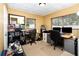 Home office equipped with two desks, office chairs, cabinets, and two computer monitors at 4111 Dublin St, Orlando, FL 32812