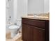 Bathroom with tile flooring, a vanity with dark wood cabinets, and a tub with shower at 437 Caribbean Ct, Kissimmee, FL 34759