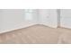 Well-lit, carpeted bedroom with a large window and neutral walls at 437 Caribbean Ct, Kissimmee, FL 34759