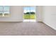 Bright living room with sliding glass doors to the backyard offering plenty of natural light at 437 Caribbean Ct, Kissimmee, FL 34759