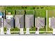 Overhead view of houses with green lawns, driveways, and nearby roads, offers a glimpse into a residential area at 4444 Quartz Ct, Lakeland, FL 33811