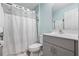 Well-lit bathroom with a shower/tub combination and gray vanity with countertop space at 4444 Quartz Ct, Lakeland, FL 33811