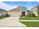 Charming single-story home features a well-maintained lawn and a two-car garage at 4444 Quartz Ct, Lakeland, FL 33811