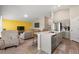 Cozy living room featuring a large island with seating that opens into the kitchen and living areas at 4444 Quartz Ct, Lakeland, FL 33811