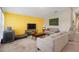 Bright living room featuring cozy sofas, a media console and large windows at 4444 Quartz Ct, Lakeland, FL 33811