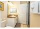 Well-lit bathroom with a vanity, large mirror, and convenient towel storage next to the shower at 515 Rum Run # 33515, Davenport, FL 33897