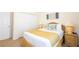 Bedroom with a bed, side tables, lamps, and closet, creating a comfortable and functional space at 515 Rum Run # 33515, Davenport, FL 33897