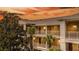 Exterior view of a condo building at sunset with palm trees at 515 Rum Run # 33515, Davenport, FL 33897