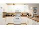 Kitchen area featuring white appliances and cabinetry at 515 Rum Run # 33515, Davenport, FL 33897