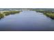 Expansive aerial view of the serene lake, perfect for boating, fishing, and enjoying nature's beauty at 515 Rum Run # 33515, Davenport, FL 33897